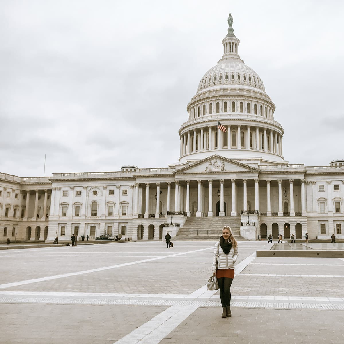 picture of the author standing in front of the capitol building