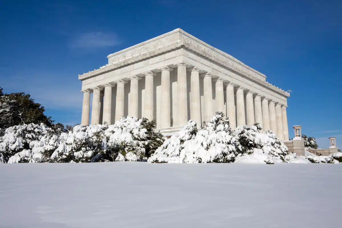 a picture of a monument in DC covered in lots of snow